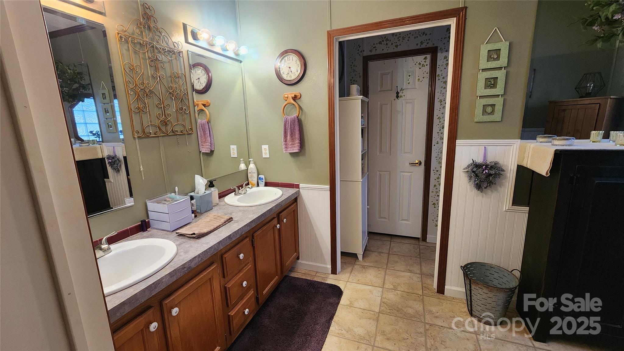 141 Hungry Creek Road Canton, NC 28716 - Photo 23 of 38 a bathroom with a sink a mirror and a shower