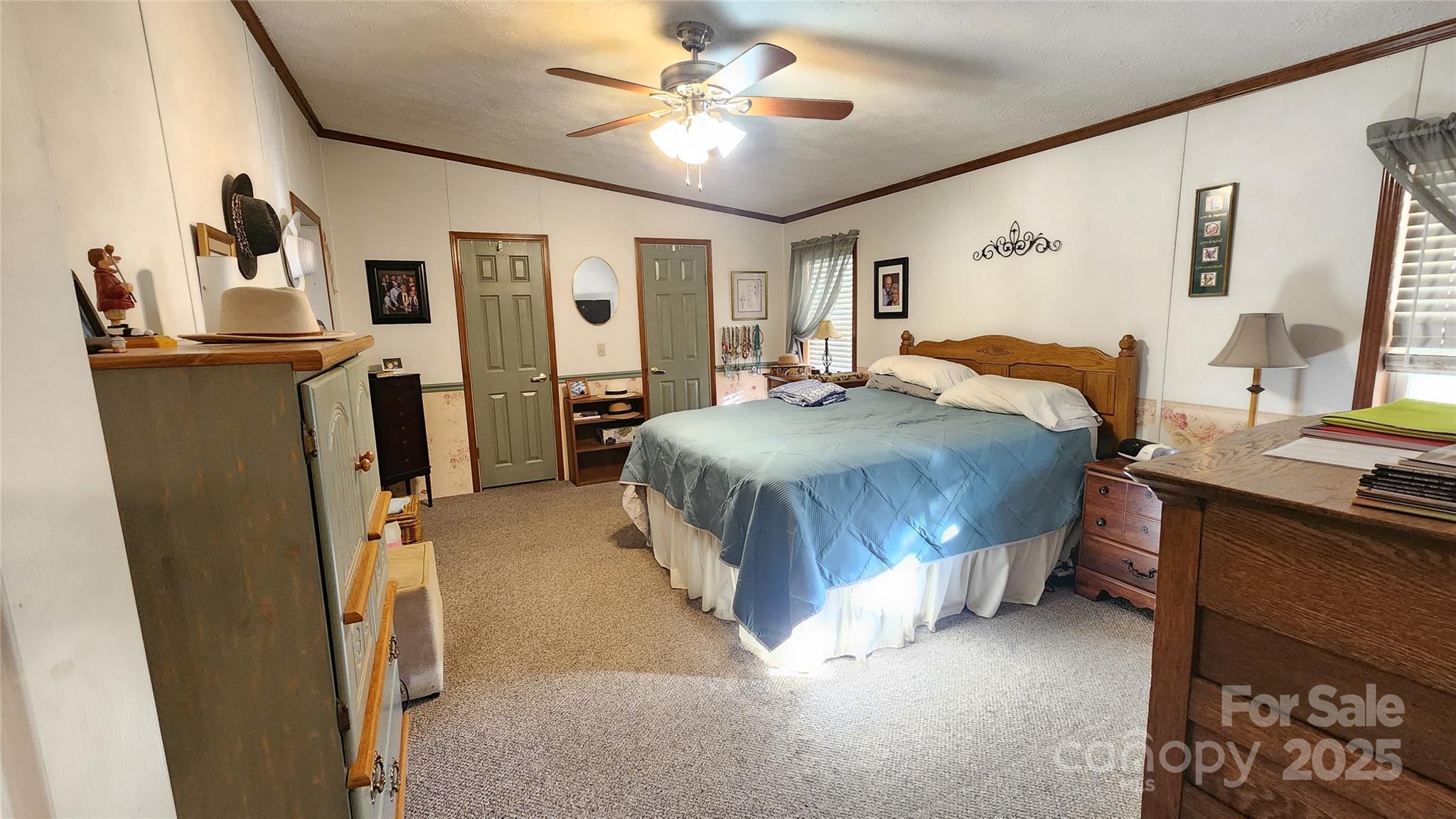 141 Hungry Creek Road Canton, NC 28716 - Photo 25 of 38 a bedroom with a bed dresser and a window