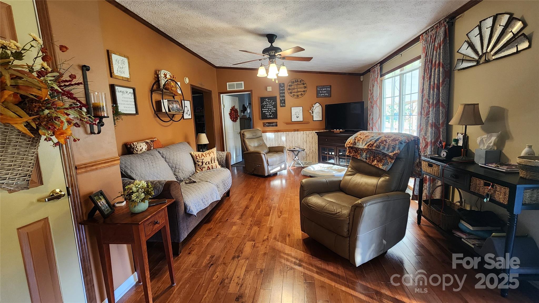 141 Hungry Creek Road Canton, NC 28716 - Photo 26 of 38 a living room with furniture and a chandelier