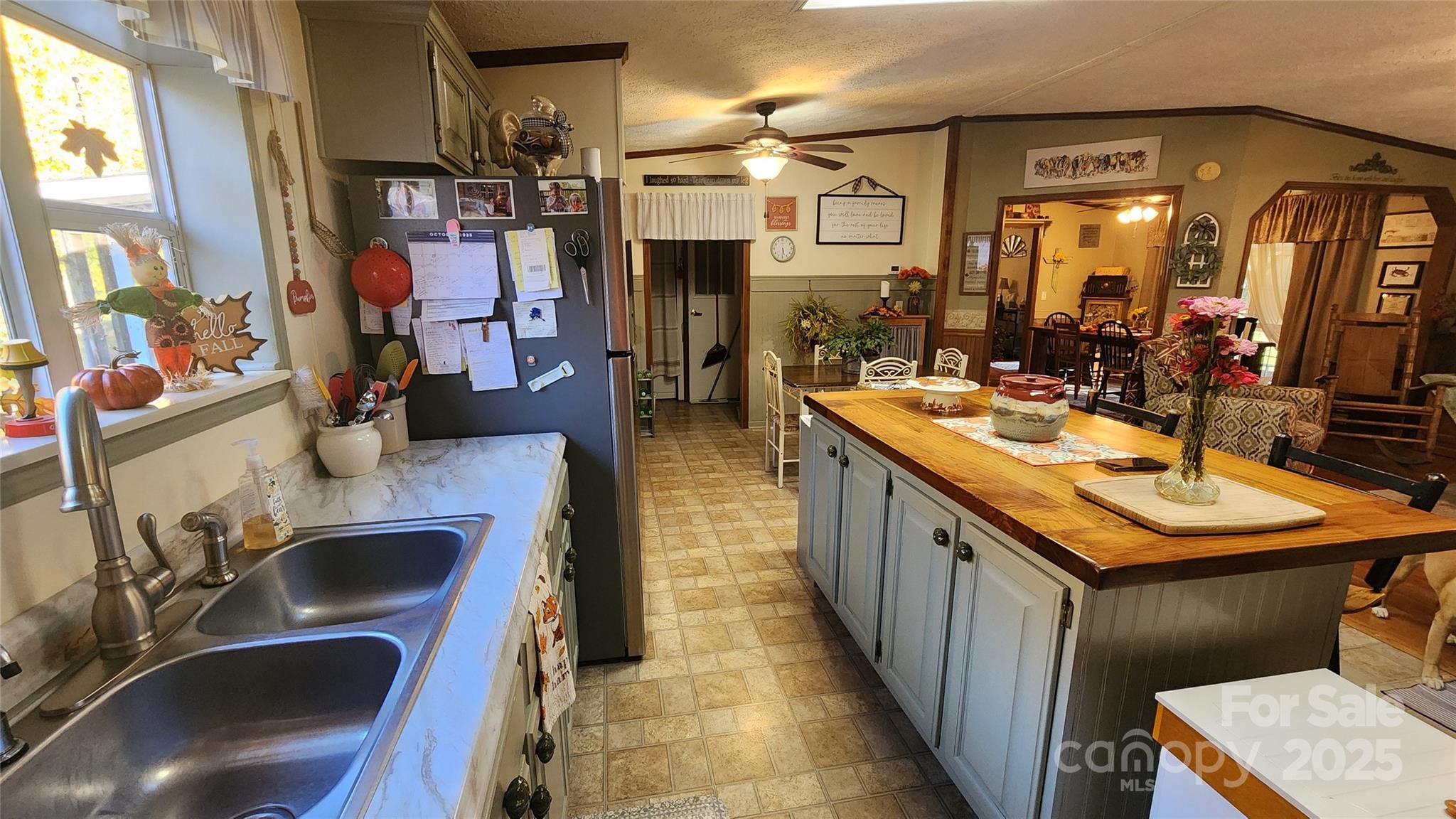 141 Hungry Creek Road Canton, NC 28716 - Photo 29 of 38 a kitchen with kitchen island a sink stove and cabinets