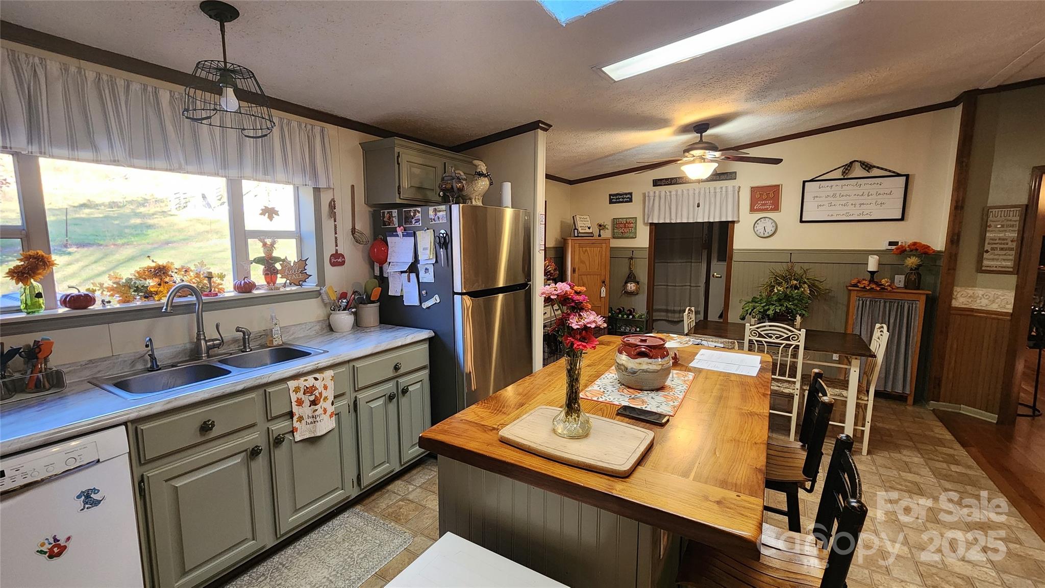 141 Hungry Creek Road Canton, NC 28716 - Photo 31 of 38 a view of a kitchen with kitchen island dining table and chairs