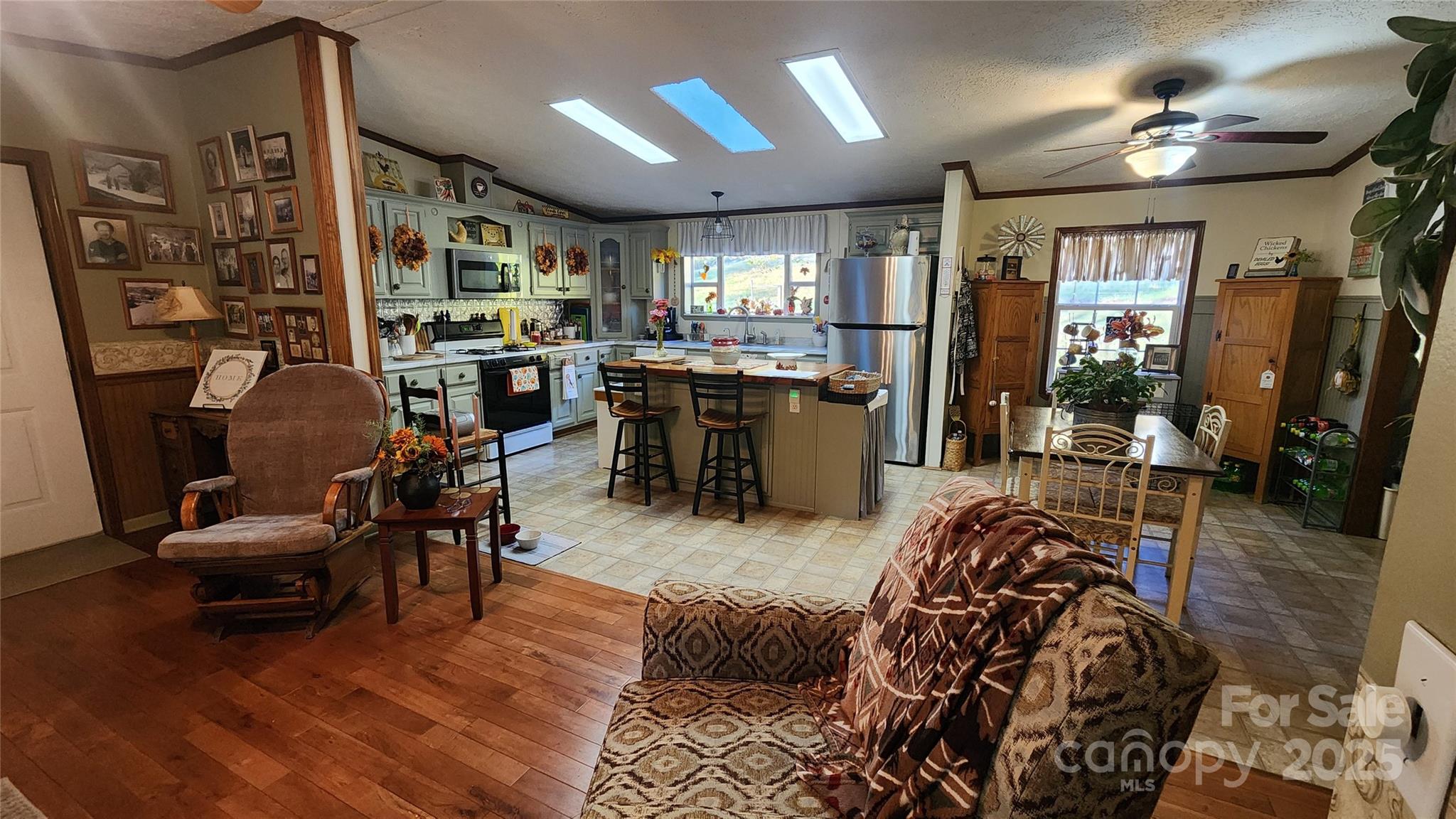 141 Hungry Creek Road Canton, NC 28716 - Photo 33 of 38 a living room with lots of furniture and wooden floor