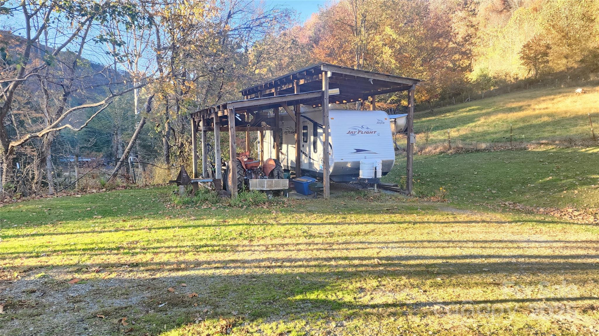 141 Hungry Creek Road Canton, NC 28716 - Photo 5 of 38 a view of a house with a swimming pool