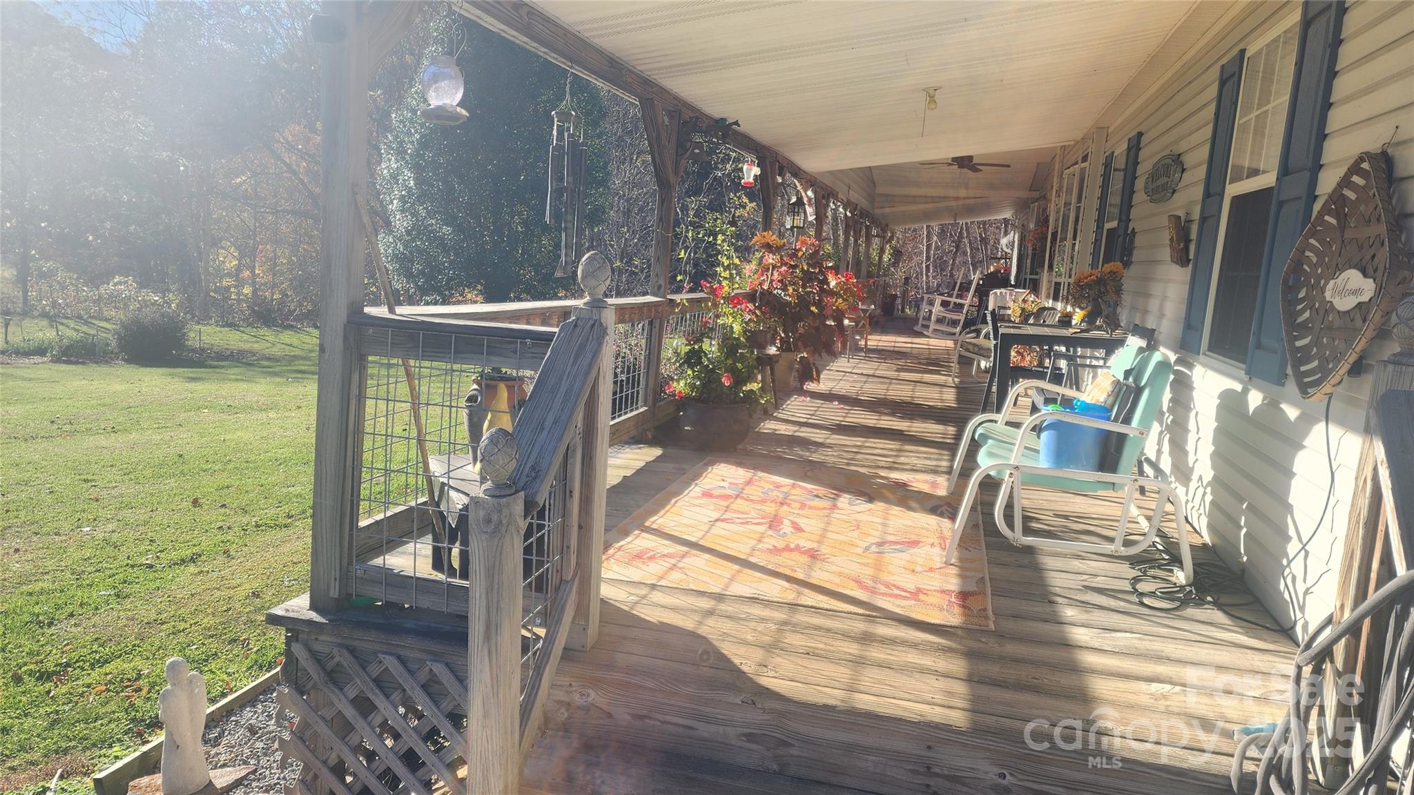 141 Hungry Creek Road Canton, NC 28716 - Photo 8 of 38 a view of a porch with wooden floor and outdoor space