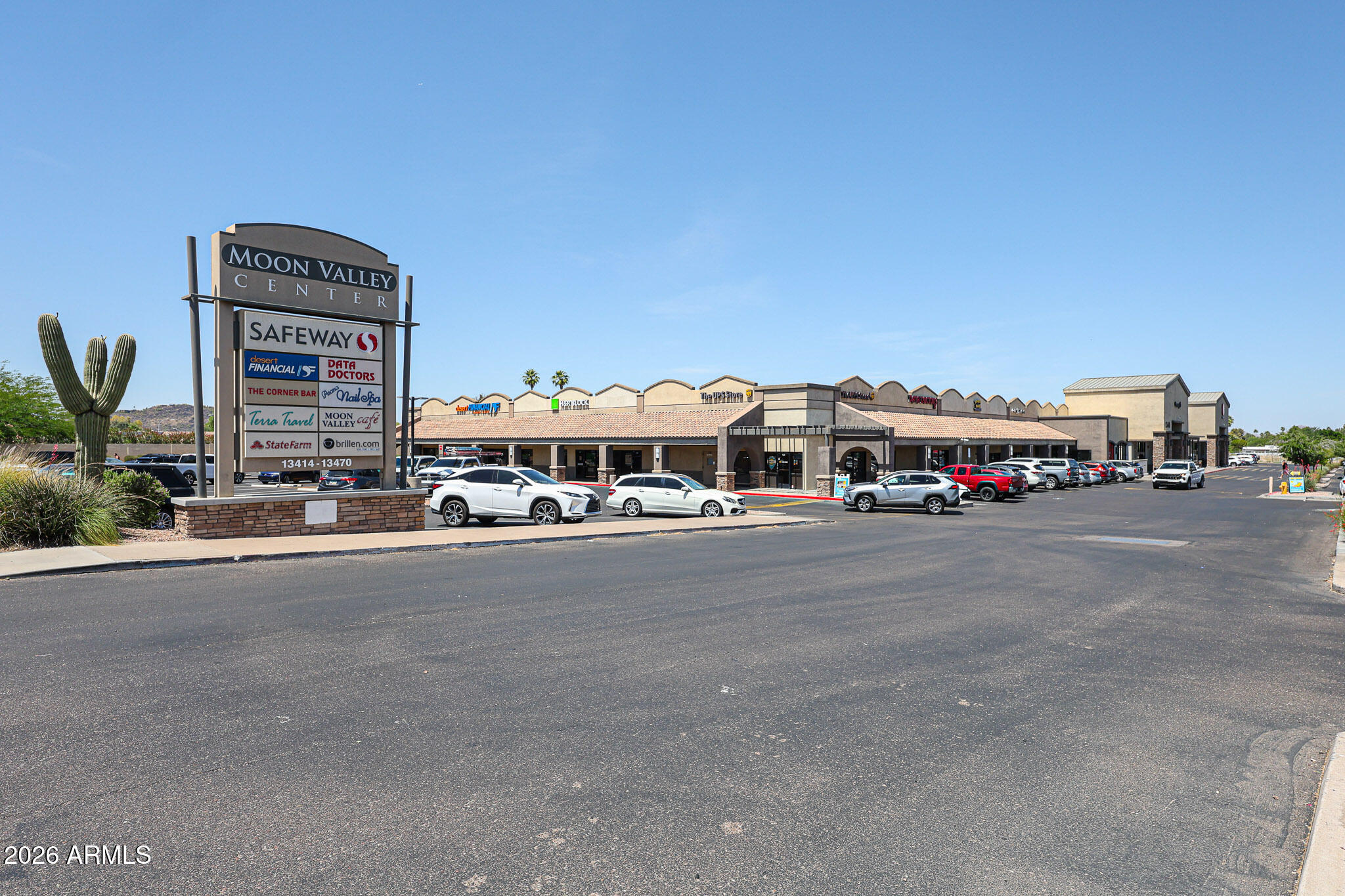 10410 North Cave Creek Road, Unit 1011 Phoenix, AZ 85020 - Photo 44 of 54 a tall buildings with a bench in front of it