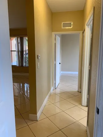 a view of a livingroom and a hallway