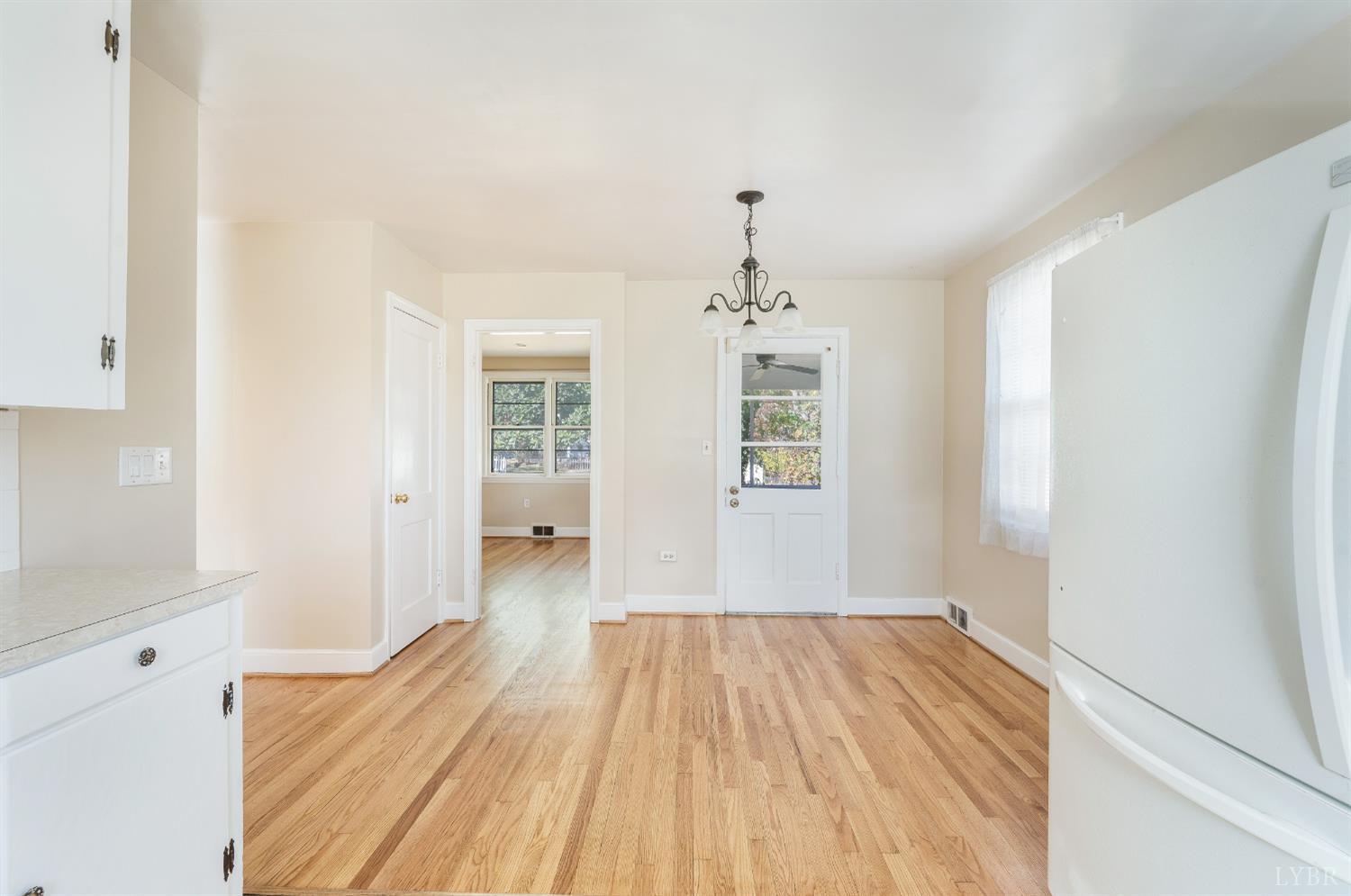 710 Riverside Drive Lynchburg, VA 24503 - Photo 21 of 53 a view of a room with wooden floor and chandelier