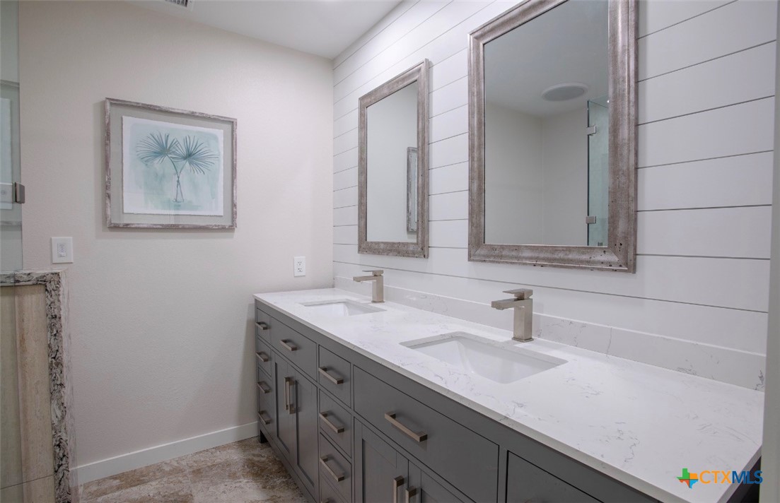188 Cavalry Road Victoria, TX 77905 - Photo 10 of 30 a bathroom with a sink and a mirror