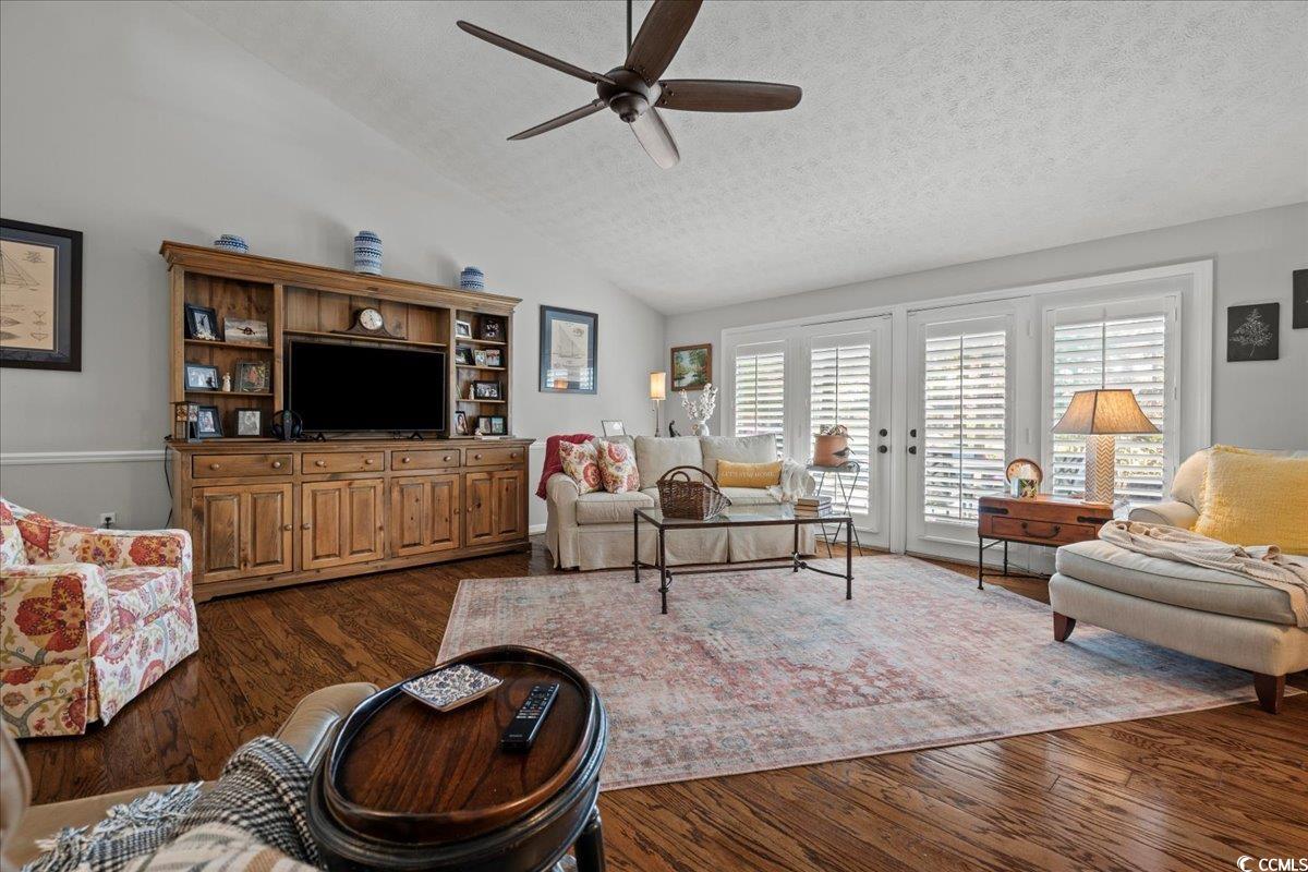 117 John Waites Court Georgetown, SC 29440 - Photo 5 of 40 Living room with lofted ceiling, dark wood finished floors, a textured ceiling, and ceiling fan