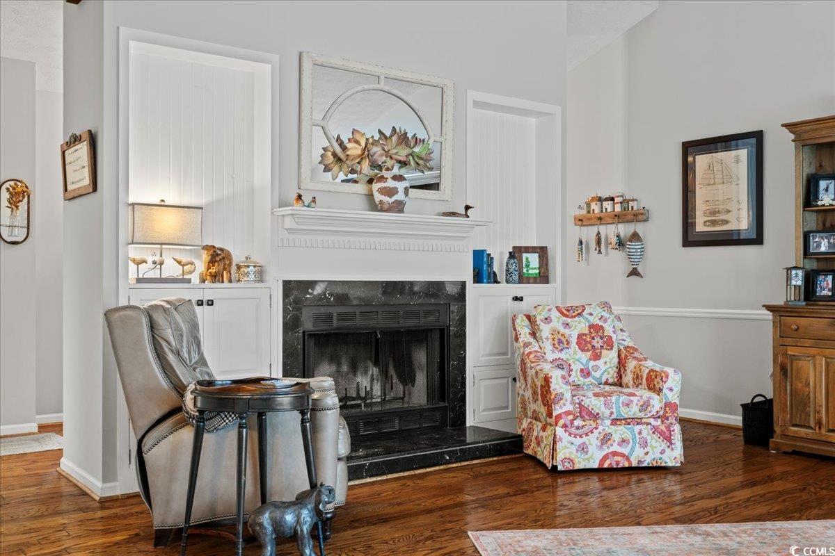 117 John Waites Court Georgetown, SC 29440 - Photo 8 of 40 Living area featuring a fireplace and dark wood finished floors
