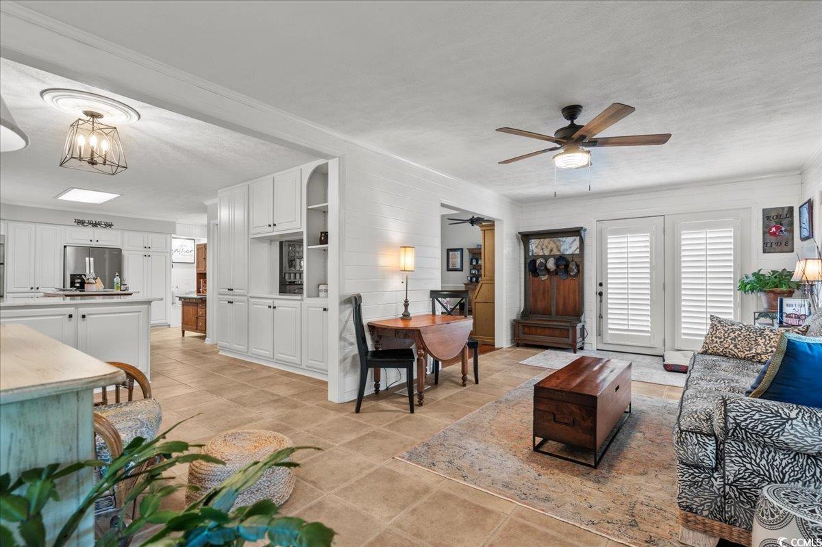 117 John Waites Court Georgetown, SC 29440 - Photo 9 of 40 Living area featuring a textured ceiling, ceiling fan, and light tile patterned floors