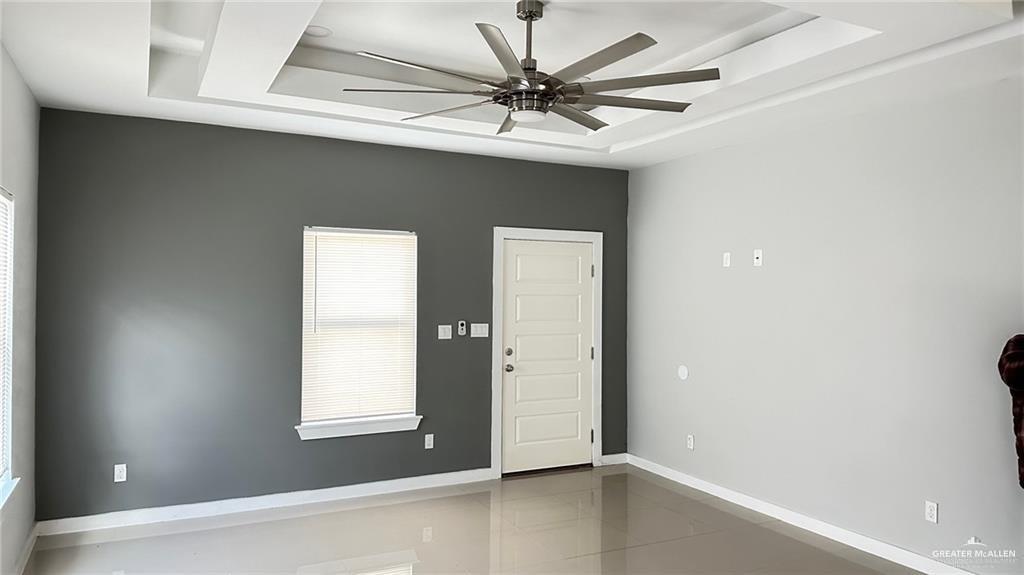 1908 Harrison Street, Unit 14 Weslaco, TX 78599 - Photo 10 of 10 an empty room with a window and a ceiling fan