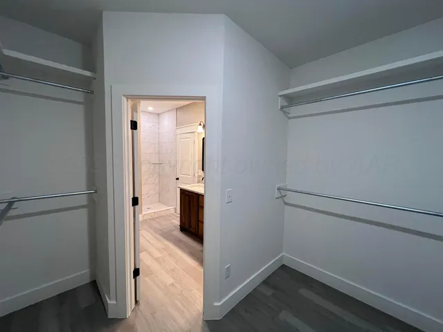 a view of storage and utility room with washer and dryer