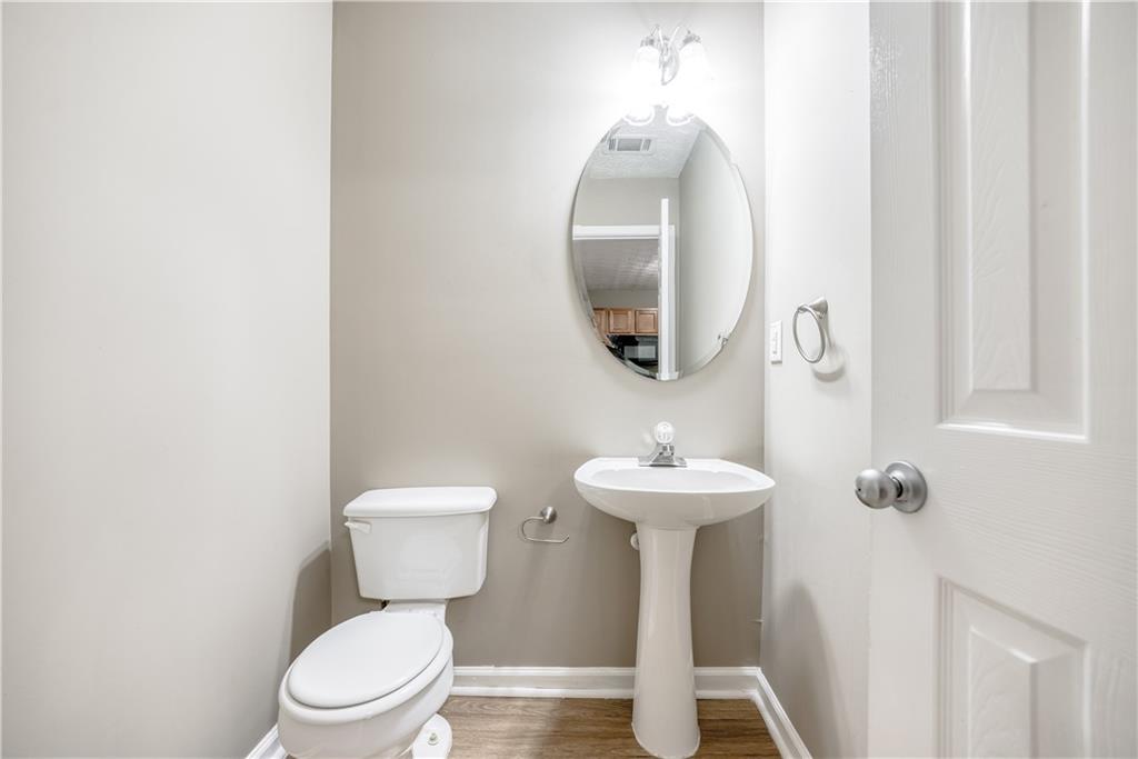2913 Vining Ridge Terrace Decatur, GA 30034 - Photo 14 of 28 a bathroom with a toilet sink and mirror