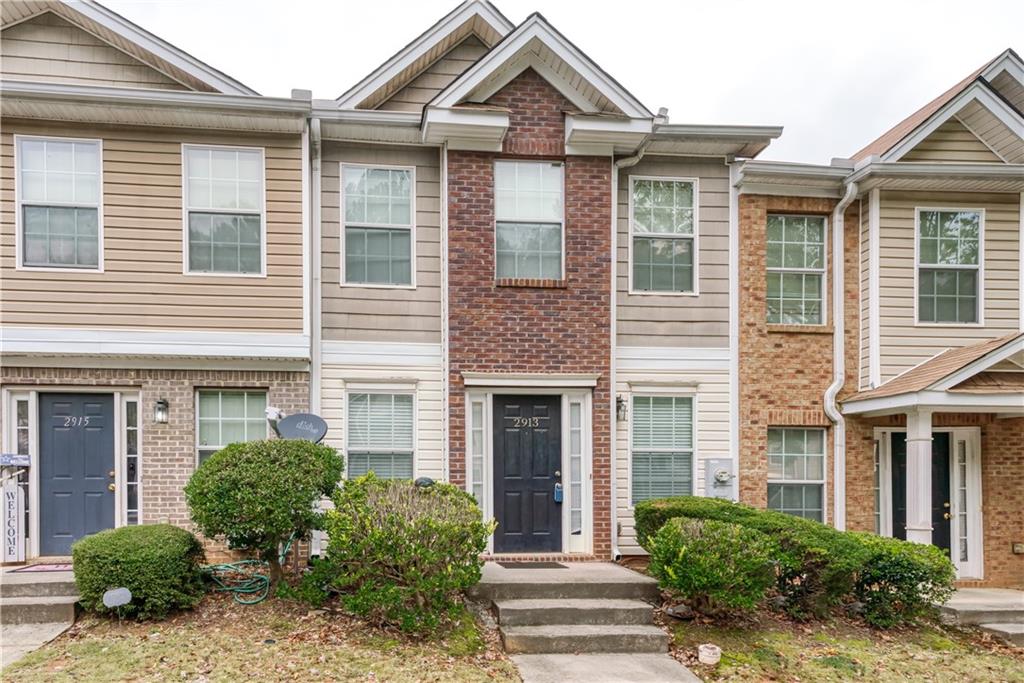 2913 Vining Ridge Terrace Decatur, GA 30034 - Photo 2 of 28 a front view of a house with a yard