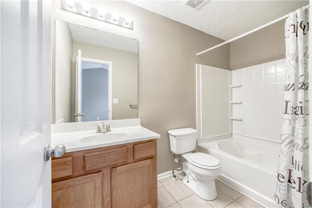 2913 Vining Ridge Terrace Decatur, GA 30034 - Photo 24 of 28 a bathroom with a sink a toilet and shower
