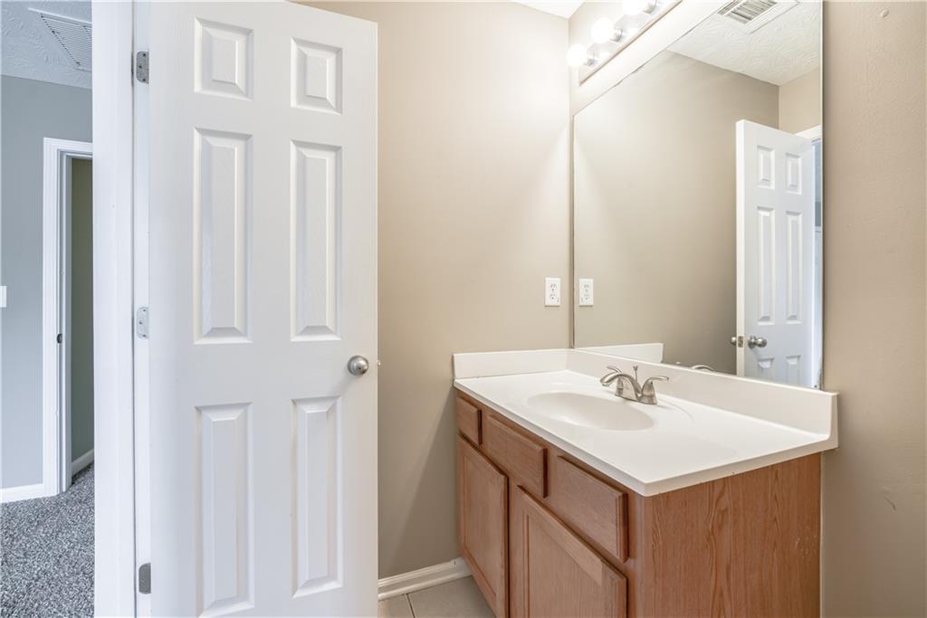 2913 Vining Ridge Terrace Decatur, GA 30034 - Photo 25 of 28 a bathroom with a sink and a mirror