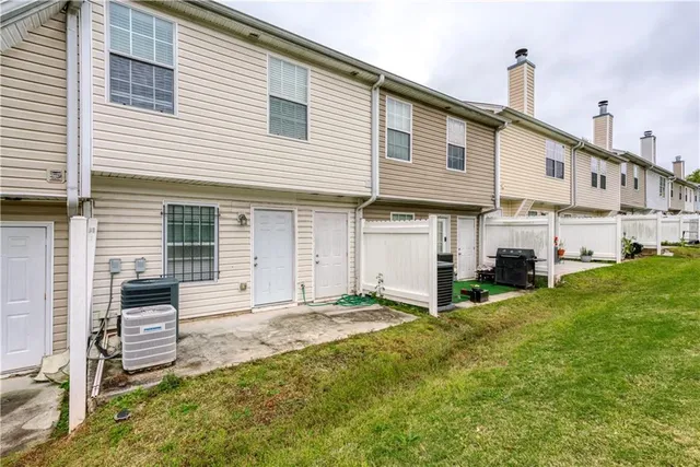 a view of a house with a back yard
