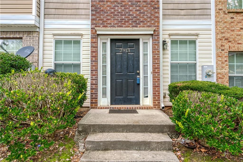2913 Vining Ridge Terrace Decatur, GA 30034 - Photo 3 of 28 a front view of a house with a garden