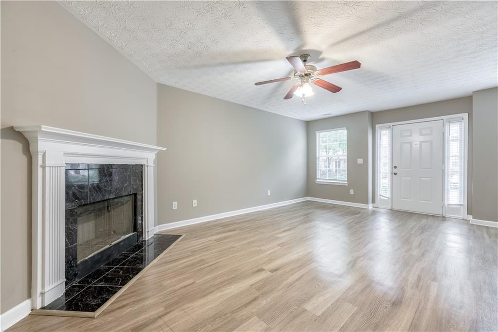 2913 Vining Ridge Terrace Decatur, GA 30034 - Photo 6 of 28 a view of an empty room with window and wooden floor