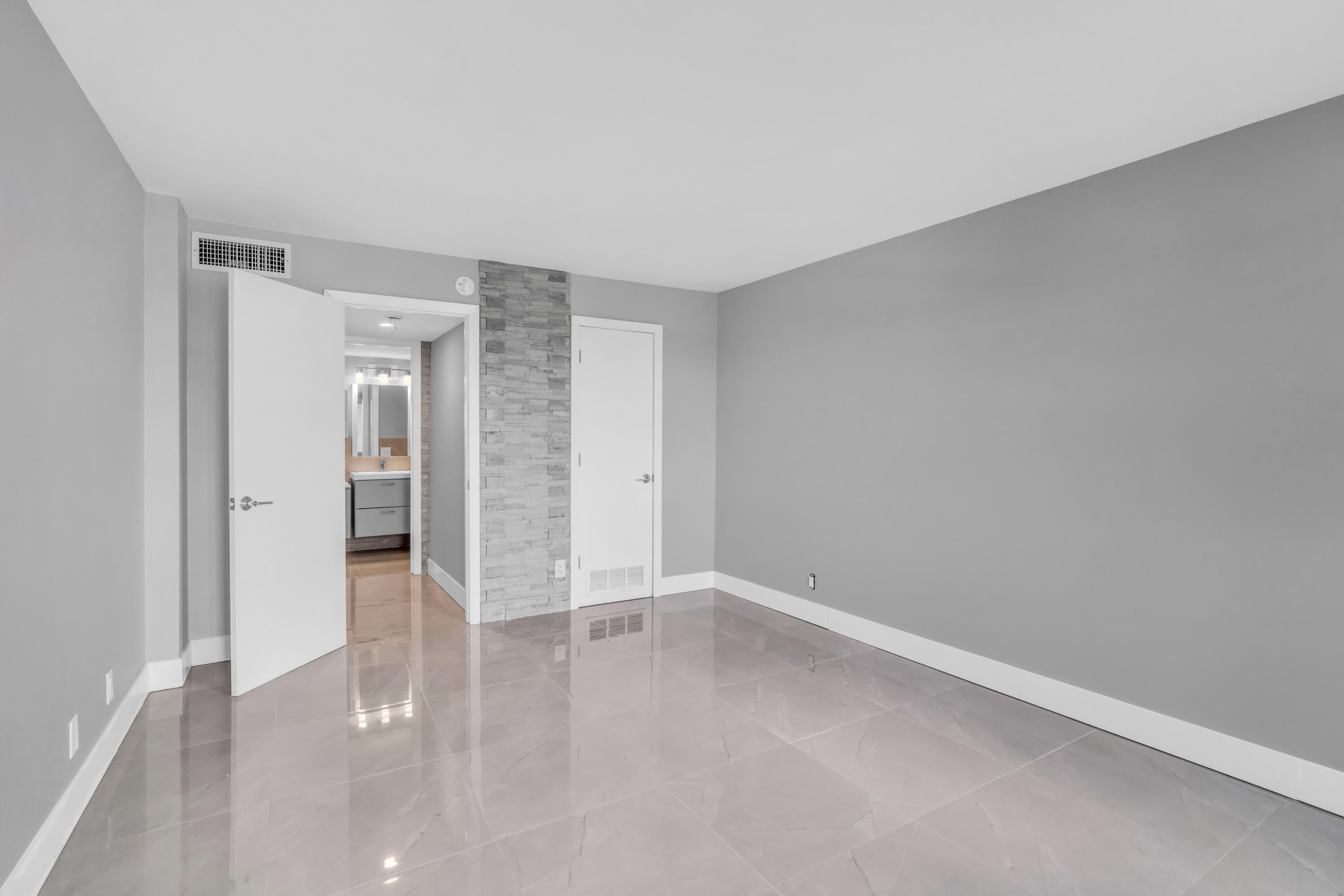 2611 North Riverside Drive, Unit 1004 Pompano Beach, FL 33062 - Photo 11 of 32 wooden floor in an empty room