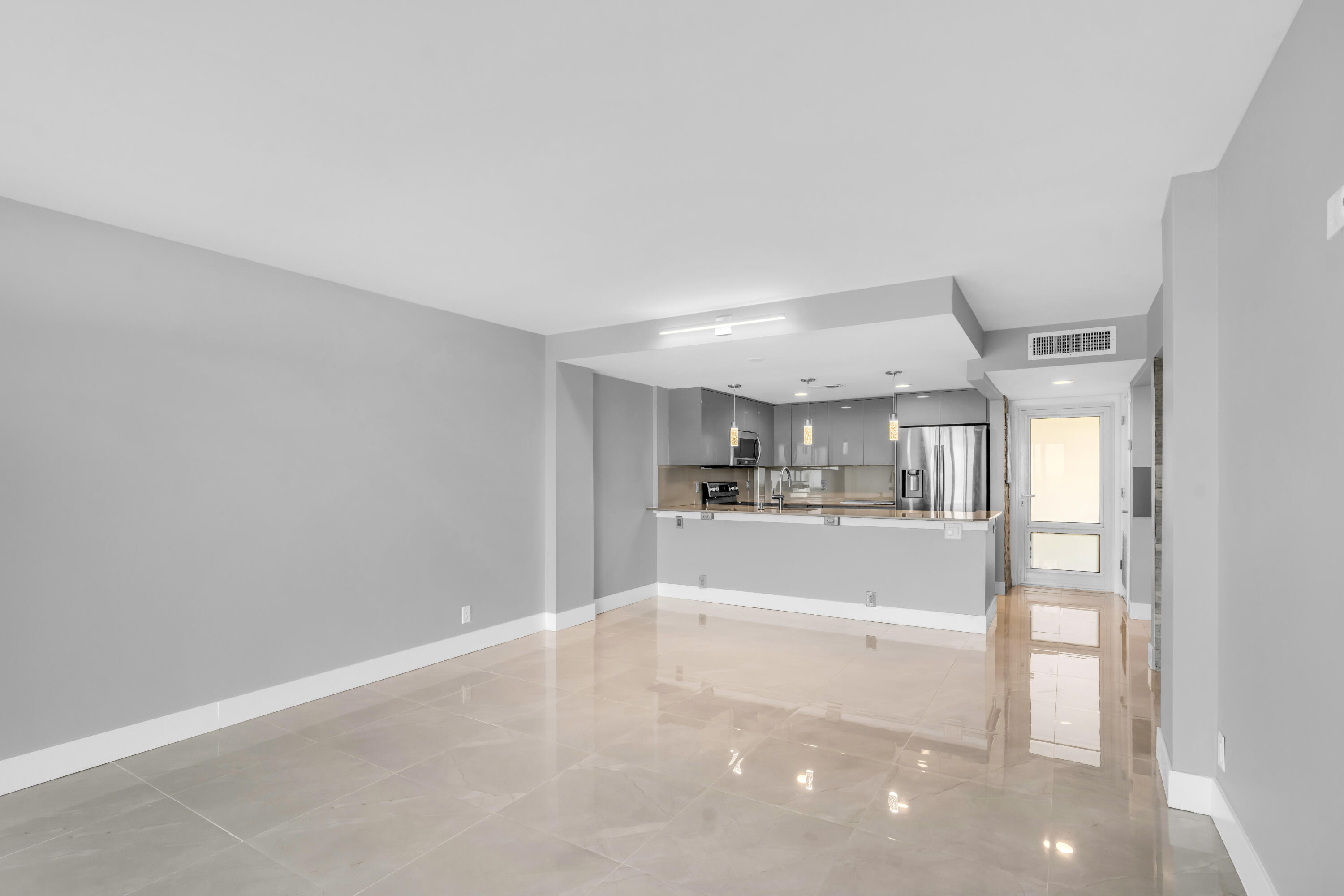 2611 North Riverside Drive, Unit 1004 Pompano Beach, FL 33062 - Photo 12 of 32 a view of a open shower and a kitchen