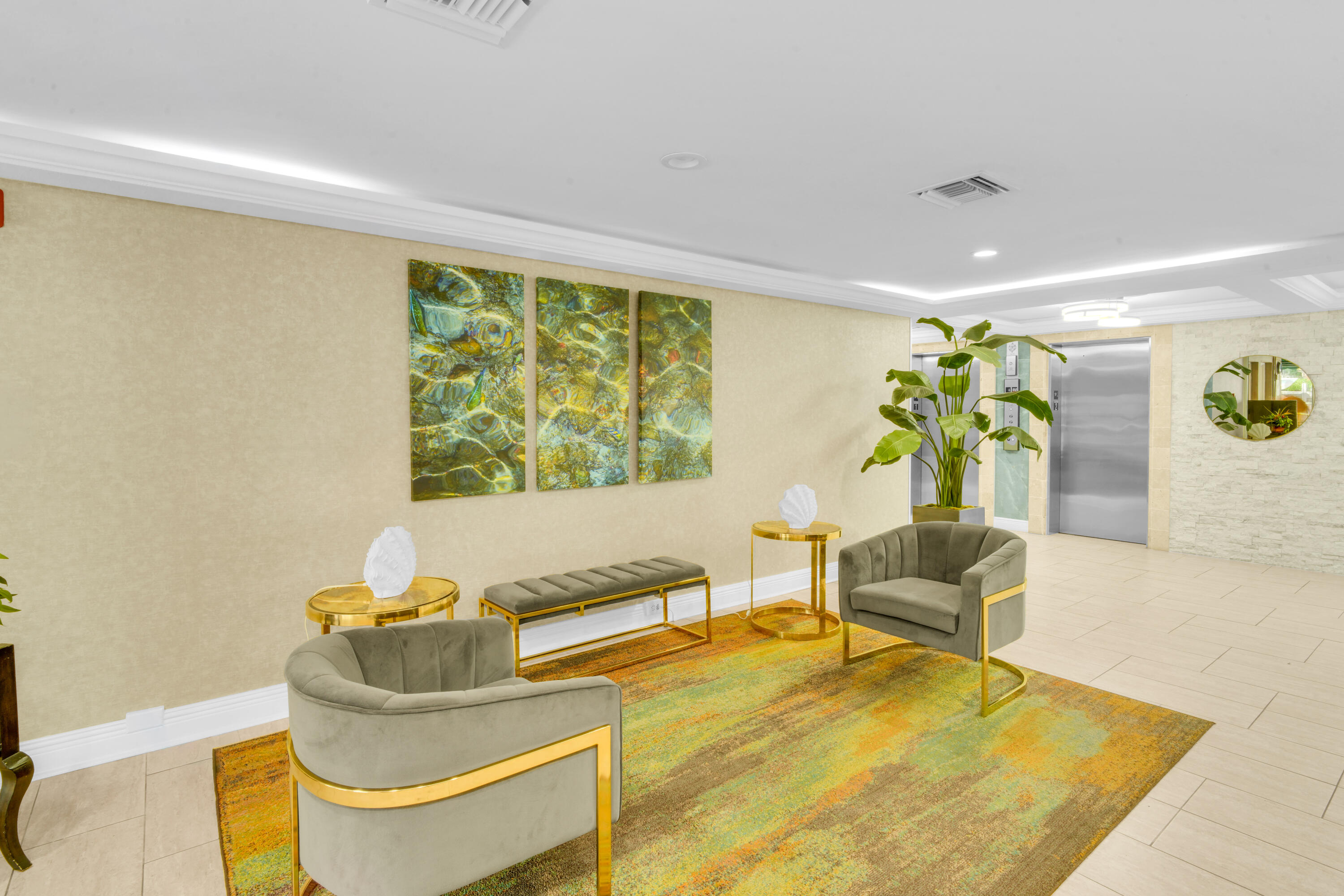 2611 North Riverside Drive, Unit 1004 Pompano Beach, FL 33062 - Photo 23 of 32 a living room with furniture and a large window