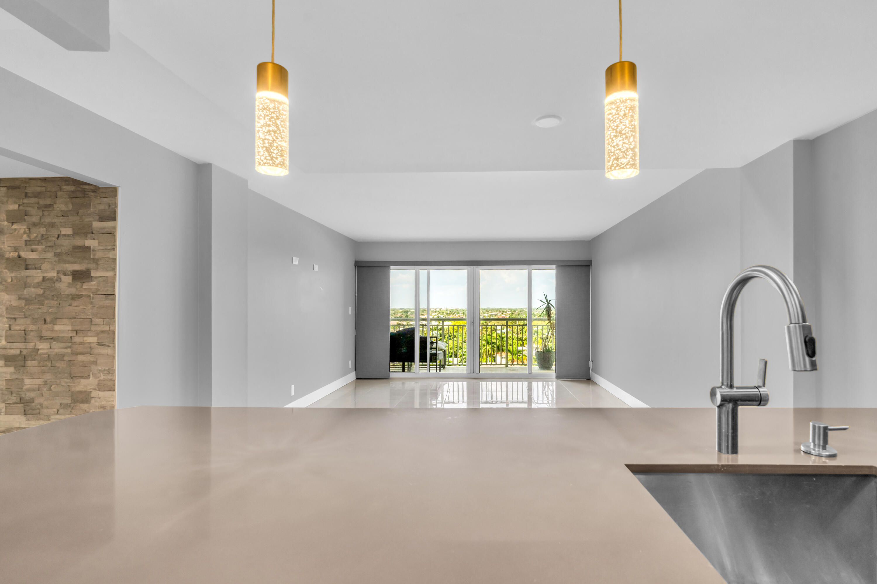 2611 North Riverside Drive, Unit 1004 Pompano Beach, FL 33062 - Photo 8 of 32 a view of a kitchen with a sink and a window