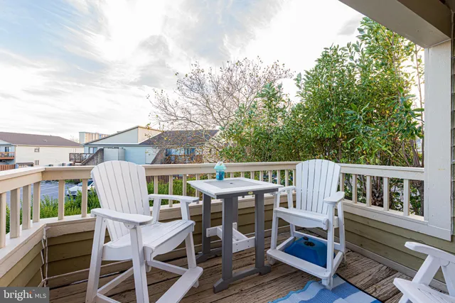 a view of a patio with a table and chairs