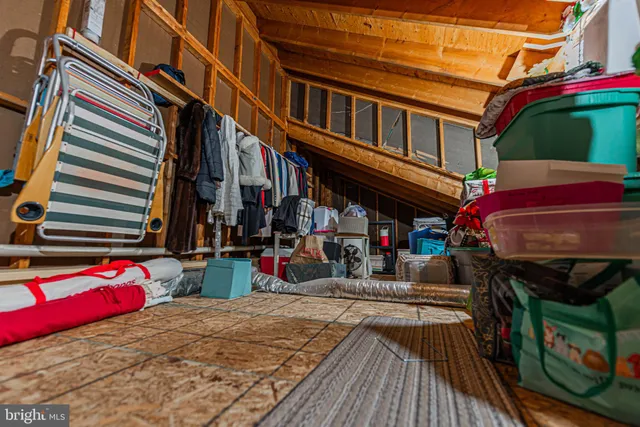 an aerial view of a city with ocean view in back