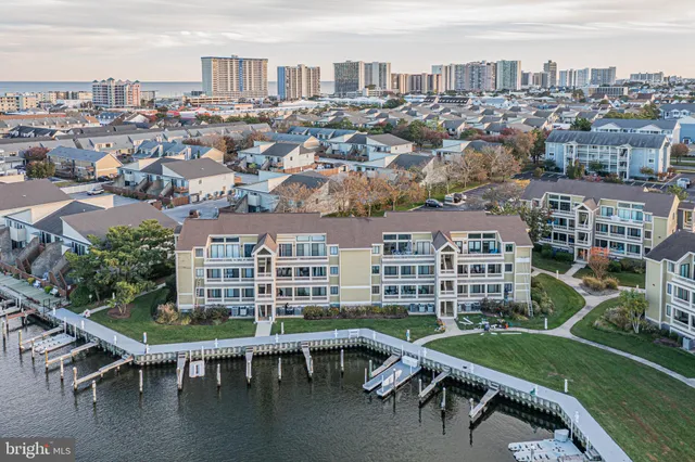 an aerial view of residential houses with outdoor space