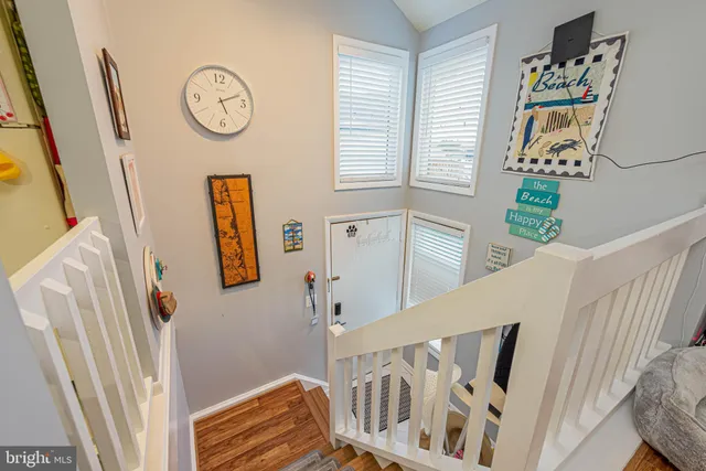 a view of an entryway with wooden floor