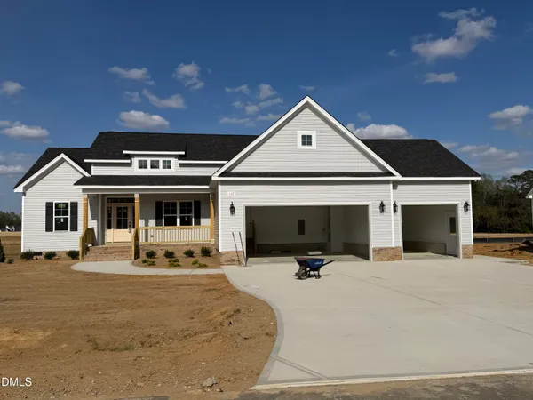 a front view of a house with swing and slide in kitchen