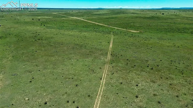 a view of a field with an outdoor space