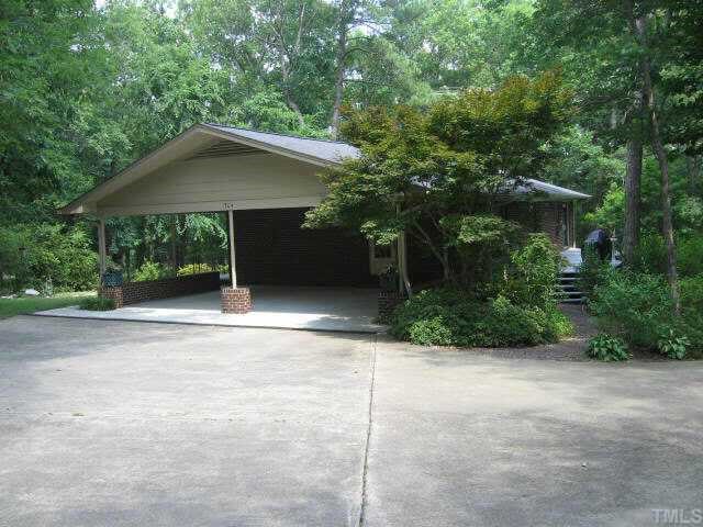a house with trees in the background