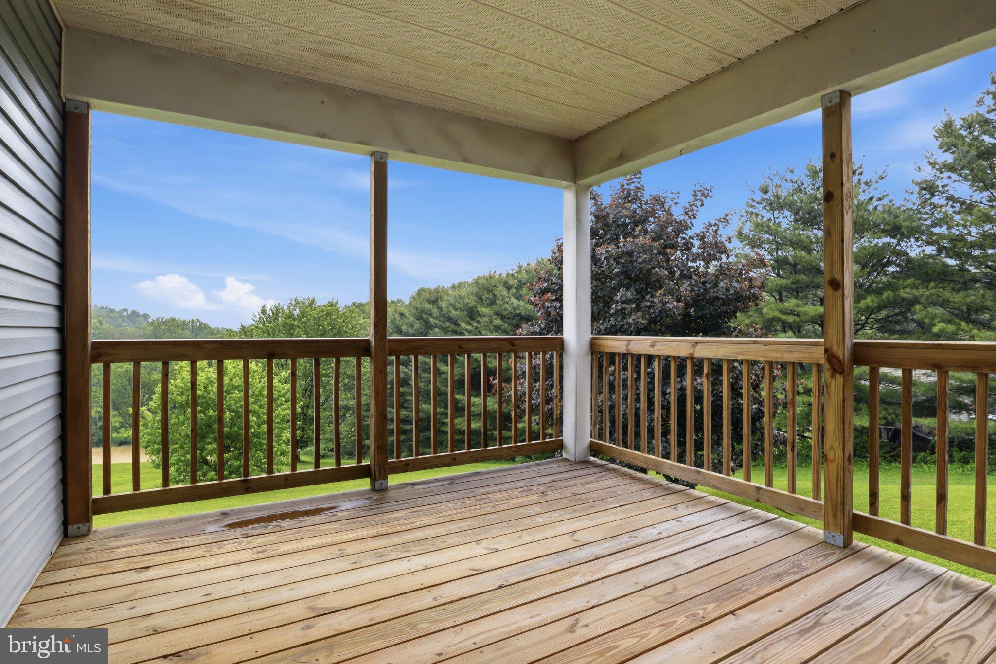 491 Garvine Mill Road Fawn Grove, PA 17321 - Photo 27 of 47 a view of a balcony with wooden floor and fence
