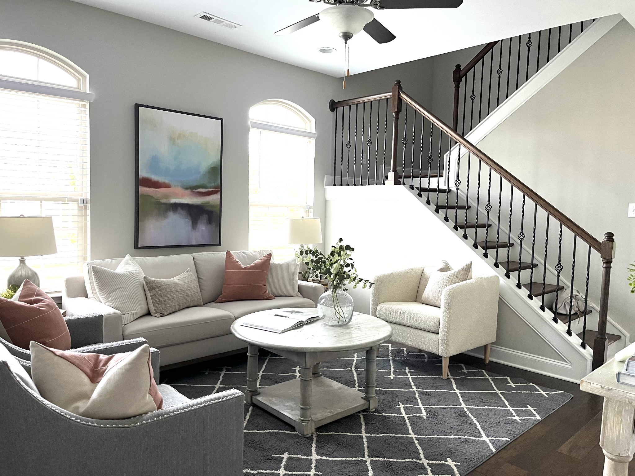 620 Weybridge Drive Nolensville, TN 37135 - Photo 13 of 33 a living room with couches a table and a potted plant with wooden floor