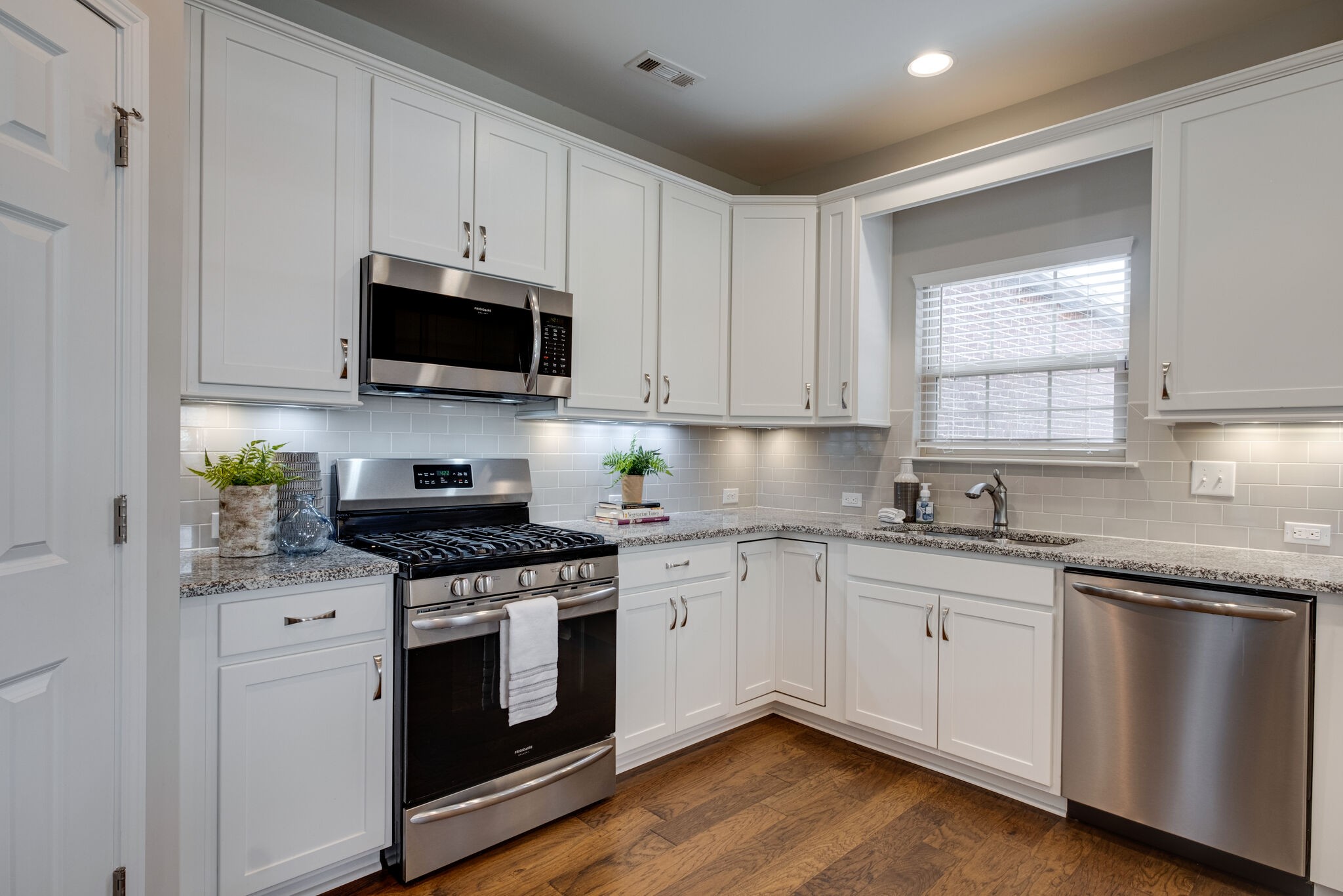 620 Weybridge Drive Nolensville, TN 37135 - Photo 16 of 33 a kitchen with granite countertop white cabinets and appliances