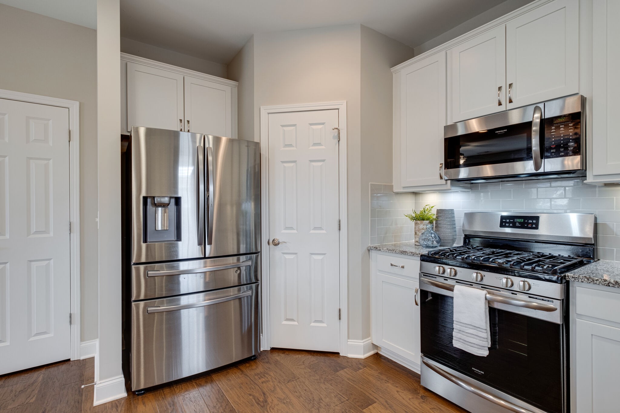 620 Weybridge Drive Nolensville, TN 37135 - Photo 17 of 33 a kitchen with stainless steel appliances white cabinets white stove a microwave and a refrigerator