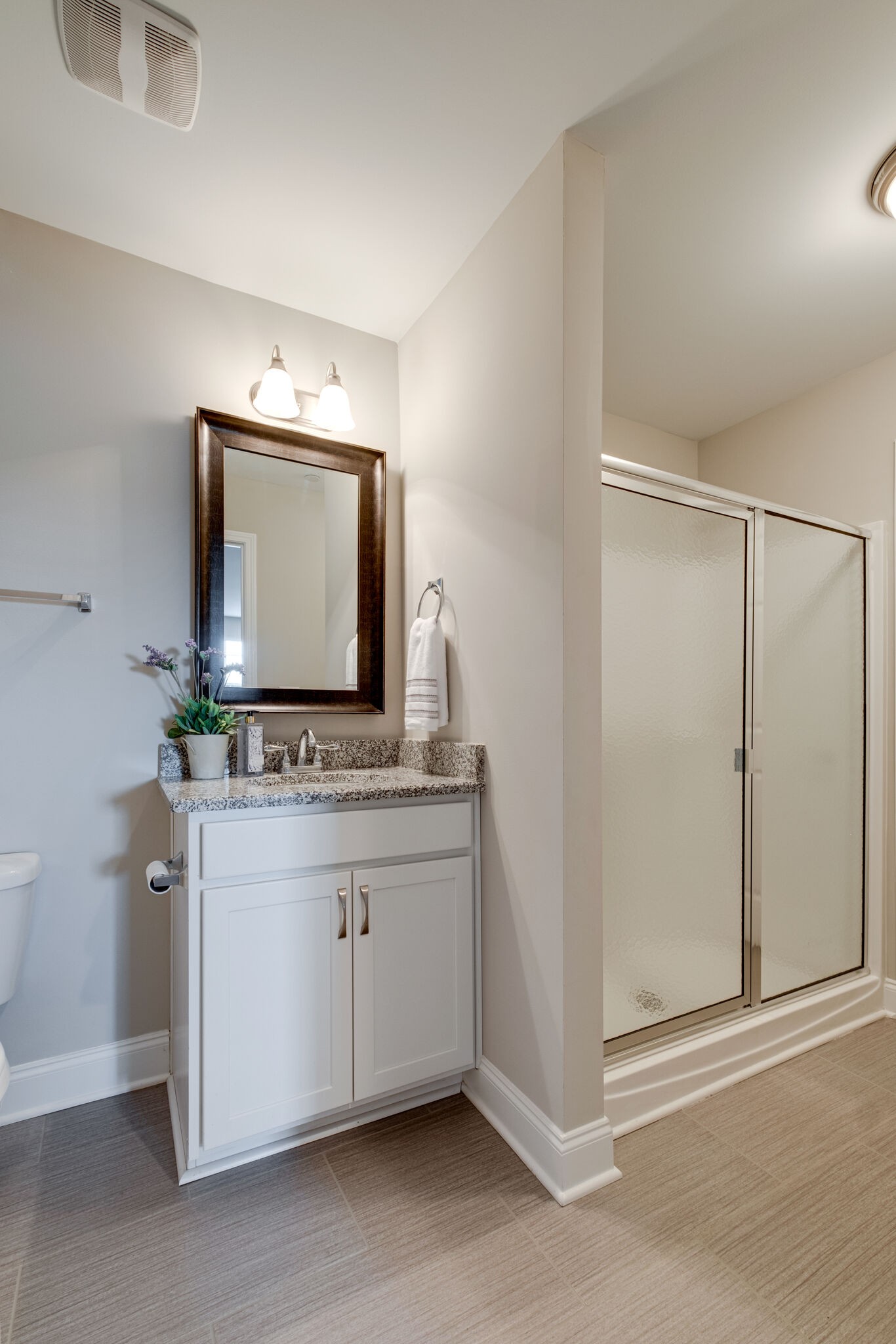 620 Weybridge Drive Nolensville, TN 37135 - Photo 32 of 33 a bathroom with a granite countertop sink a mirror and a vanity