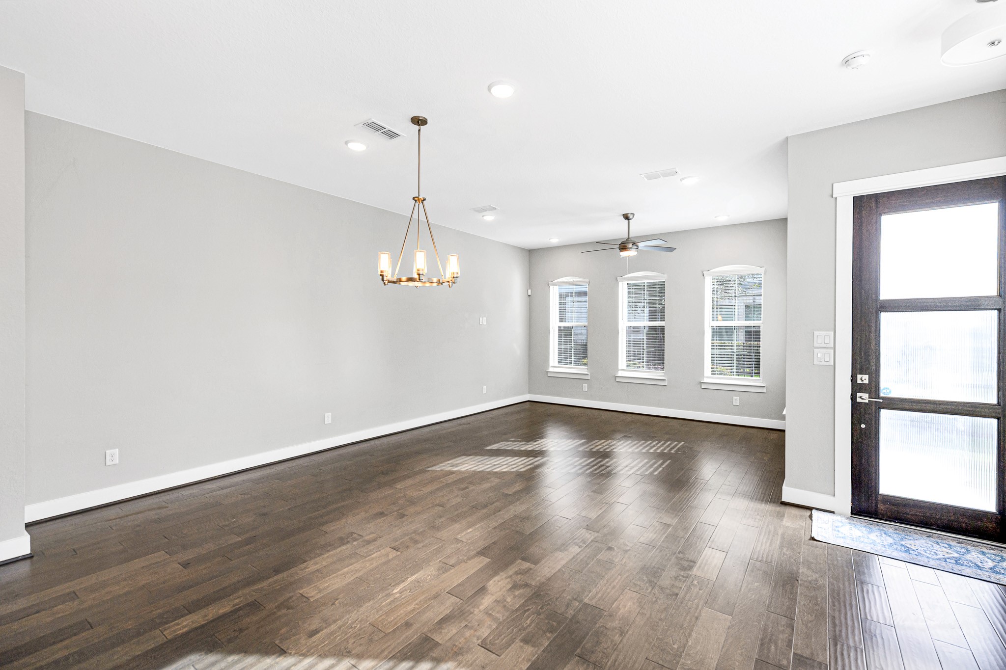 12562 Holly Blue Lane Houston, TX 77077 - Photo 11 of 39 Living room and formal dining room with plenty of natural light