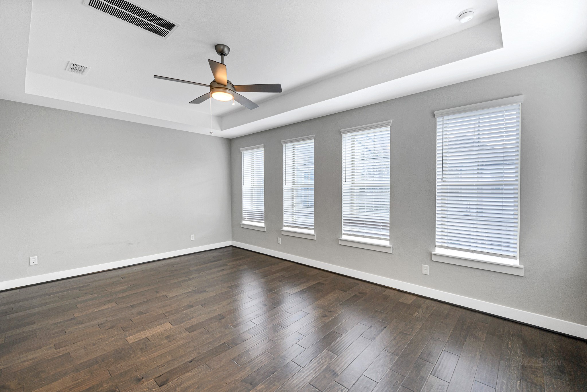 12562 Holly Blue Lane Houston, TX 77077 - Photo 26 of 39 Spacious master suite with wood floors and lots of natural light
