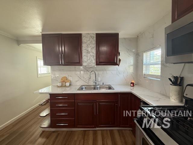 111 East Simplot Boulevard Caldwell, ID 83605 - Photo 8 of 17 Rich wood-finish cabinetry complemented by white marble-look countertops and a coordinating backsplash