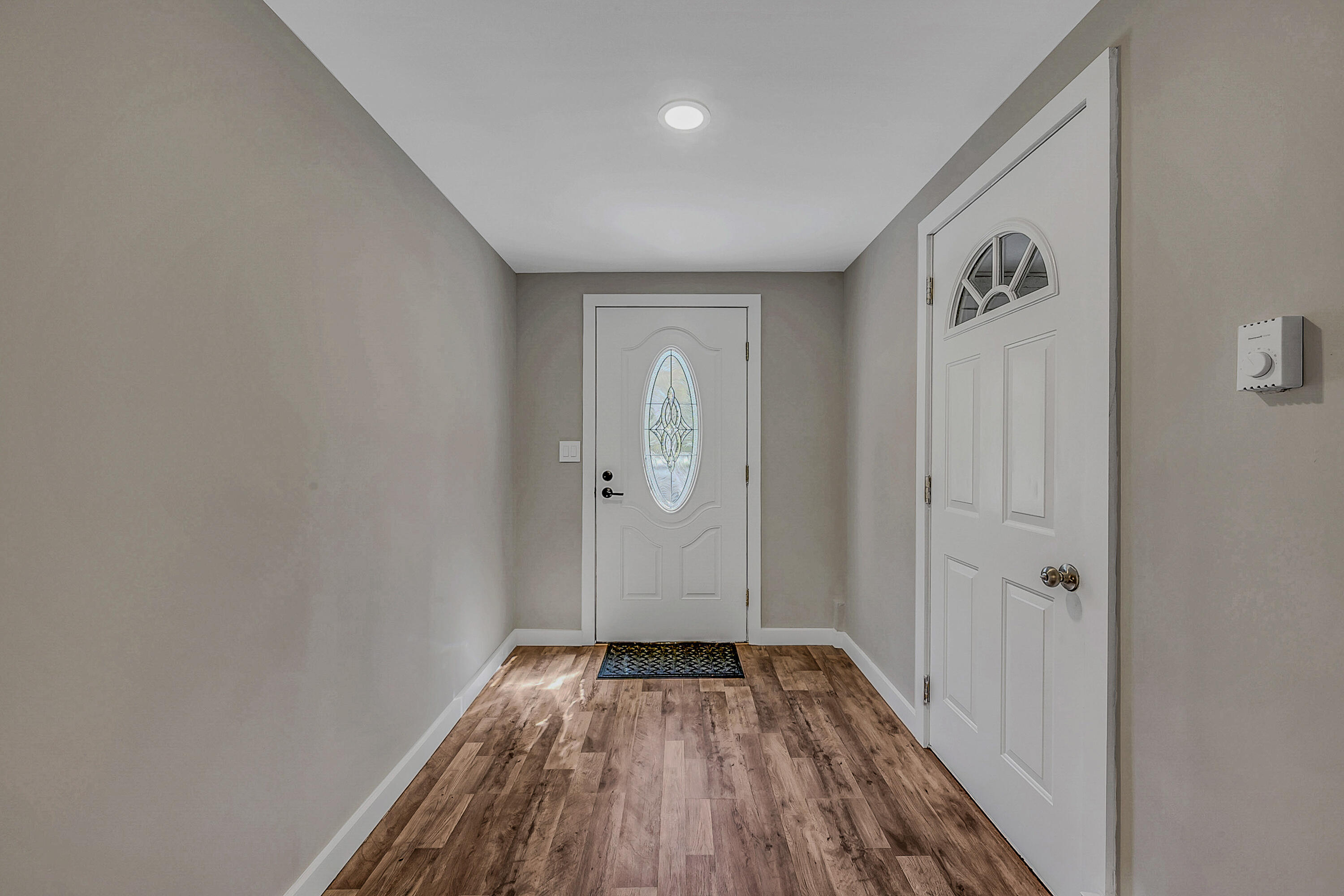 133 Neil Thompson Road Lackawaxen, PA 18425 - Photo 15 of 65 a view of a hallway with wooden floor and closet