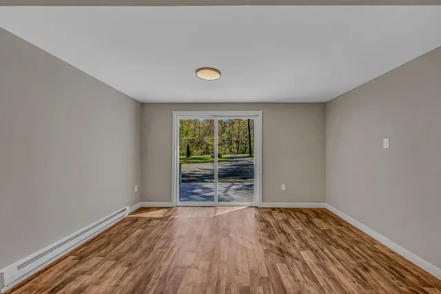 a kitchen with a sink and large window