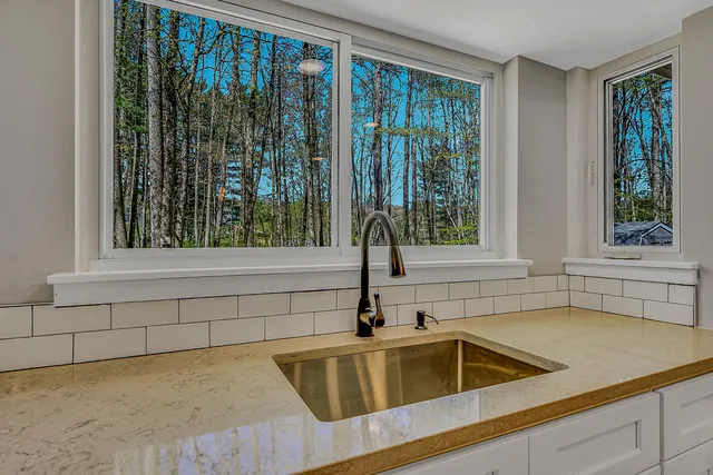 a bathroom with a bathtub and shower