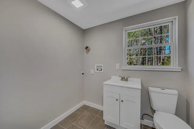 a view of room with window and wooden floor
