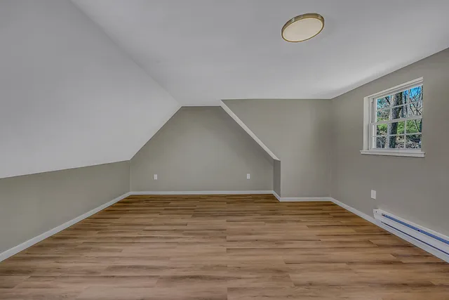 a bathroom with a sink a mirror and a window