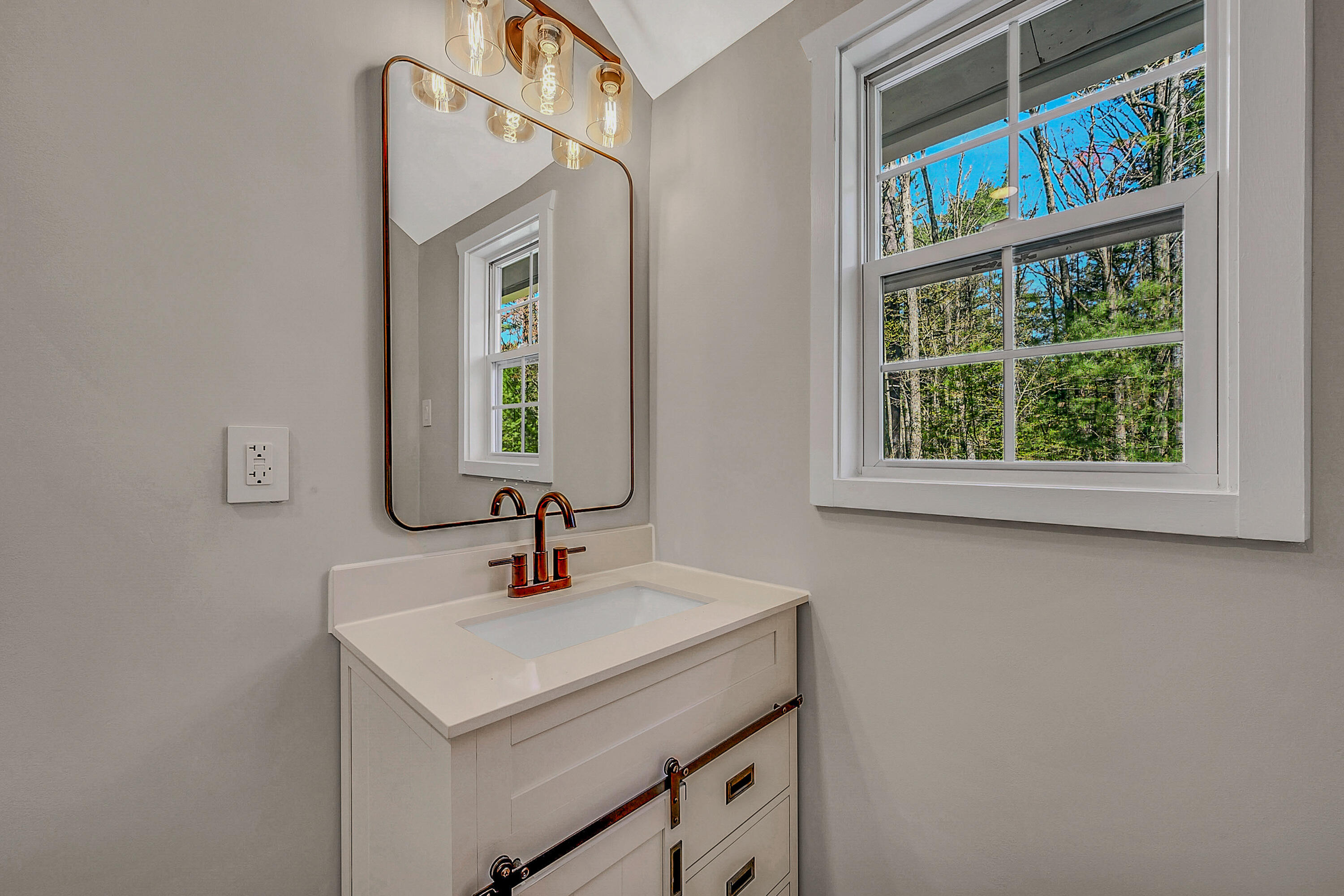 133 Neil Thompson Road Lackawaxen, PA 18425 - Photo 43 of 65 a bathroom with a sink and a mirror