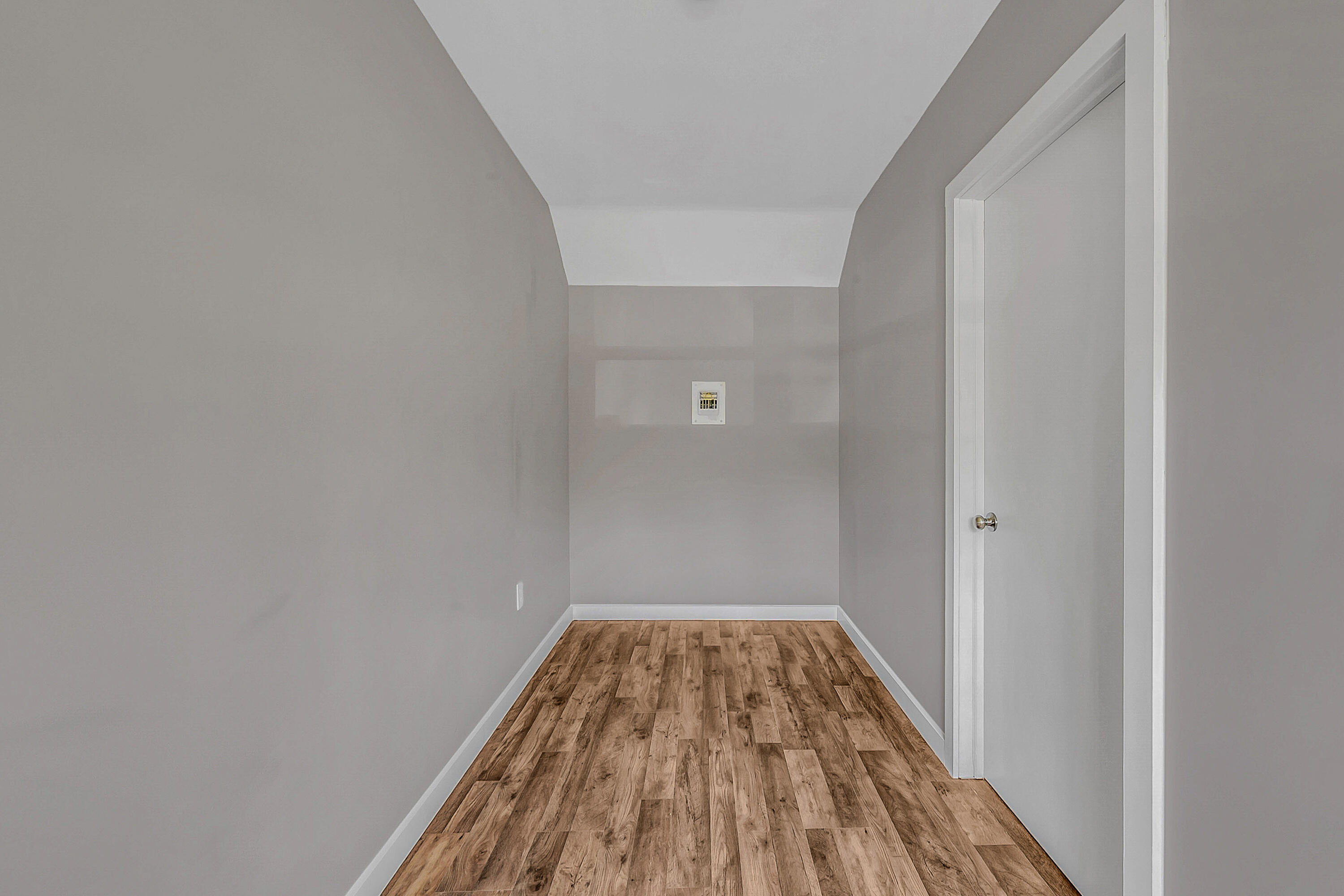 133 Neil Thompson Road Lackawaxen, PA 18425 - Photo 45 of 65 a view of a room with wooden floor and white walls
